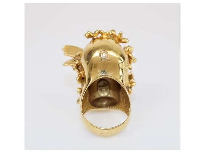 Anillo de calavera en tono dorado con mariposa y flor Alexander McQueen Talla 56 