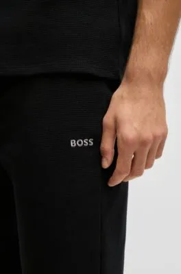 Pantalones de pijama en algodón con textura de rejilla y logo bordado